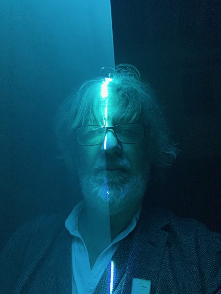 Bill Thompson in blue laser light